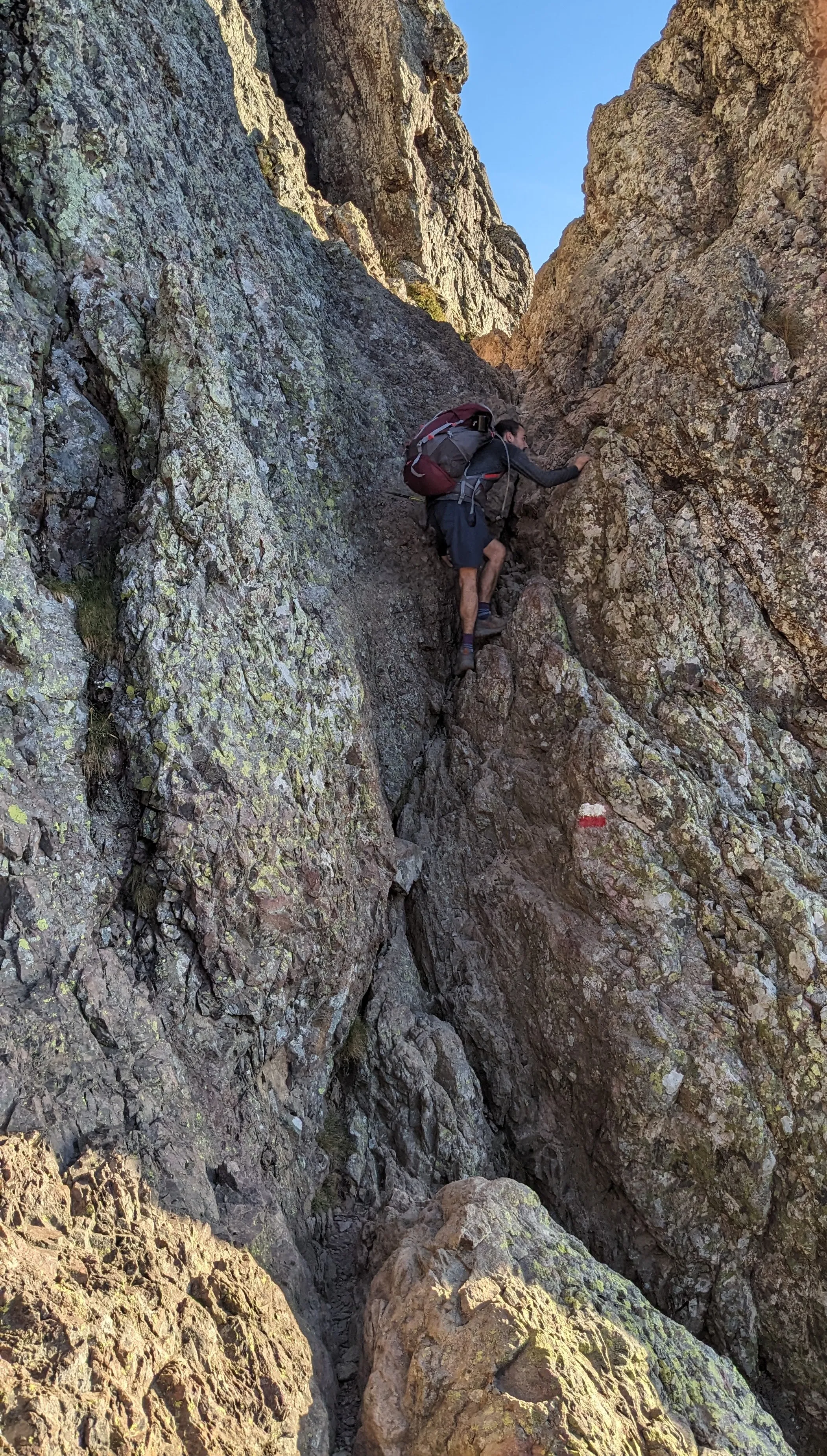Climbing a steep rocky section of the GR20