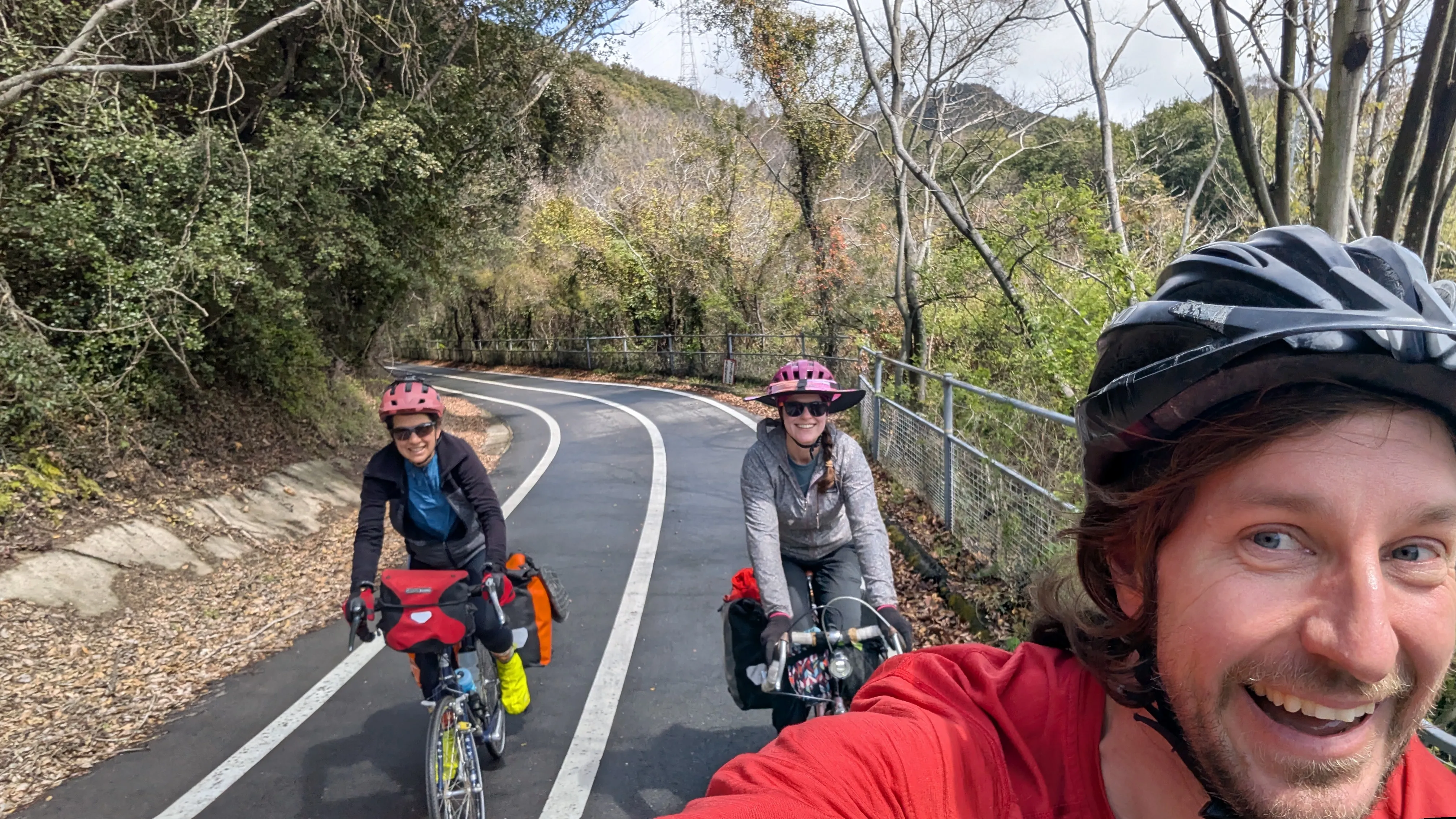 A selfie of cyclists riding on a dedicated bike path on the Shimanani Kaido